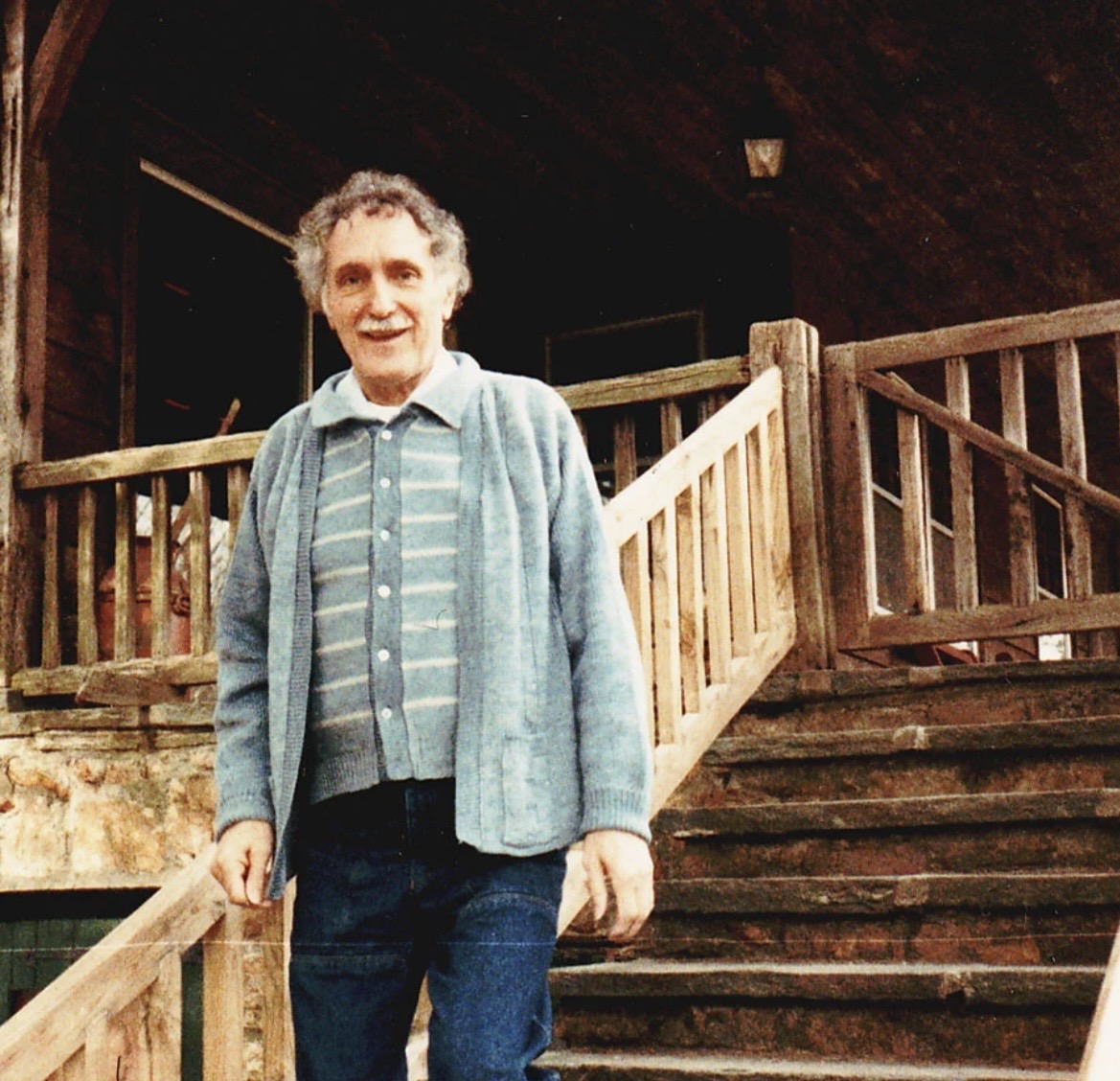 Andrija Puharich standing on stone stairs at the Devotion estate